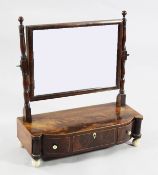 A Regency mahogany toilet mirror, fitted three frieze drawers, with projecting reeded sides, on four