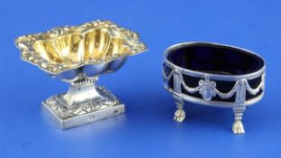 Two 19th century continental silver salts, oval with blue glass liner and ornate pedestal with