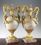 A pair of large 20th century French marble and ormolu mounted urns, the handles modelled as entwined