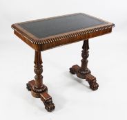 An early 19th century rosewood writing table, in the manner of Gillows, with rectangular leather