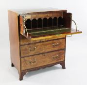 A George III mahogany and rosewood crossbanded secretaire chest, the twin dummy drawer front opening