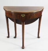 A mid 18th century walnut demi lune games table, with single drop leaf and hinged top, on pole