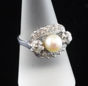 An 18ct white gold, cultured pearl and old cut diamond set cluster ring, size O.