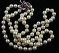 A double strand cultured pearl necklace with white gold, ruby and diamond cluster clasp, 18in.