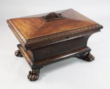 A large William IV sarcophagus shaped mahogany wine cooler, the shaped top with central finial