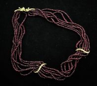 A 1980`s 18ct gold and diamond set multi strand ruby bead necklace by Asprey & Co, with two