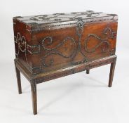 A George III camphorwood trunk on stand, with all over scrolling studded decoration, with brass side