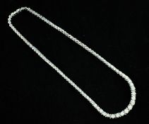 A 14ct white gold and graduated diamond choker necklace, set with one hundred and one round cut