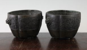 A pair of Chinese bronze flower pots, Qing dynasty, each of quatre-lobed form, with a central band