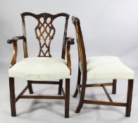 A set of eight Chippendale style mahogany dining chairs, two with arms and six singles, with moulded
