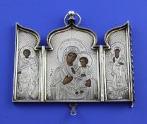 An early 20th century Russian 84 zolotnik silver triptych icon, with engine turned and sunburst