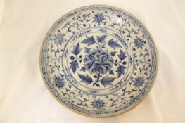 A large Annamese blue and white dish, 15th / 16th century, of circular form, the centre medallion