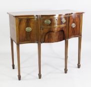 A small George III design serpentine mahogany sideboard, fitted with three drawers and single