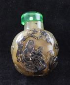 A Chinese dendritic chalcedony snuff bottle, 1760-1880, the rounded bottle carved in relief to the