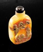 A Chinese chalcedony cameo `sage and horse` snuff bottle, 1800-1900, skillfully carved in high