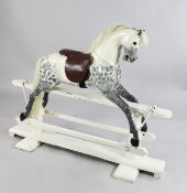 A Victorian dapple grey painted rocking horse, 4ft 2in.