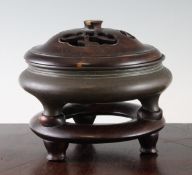 A Chinese bronze ding censer, with rosewood cover and stand, Xuande mark, 19th century, of