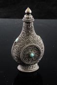 A Chinese silver filigree-work snuff bottle and screw-on stopper, c.1900, of pear shape, with