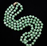 A double strand jadeite bead necklace with seed pearl set gold clasp, 22in.