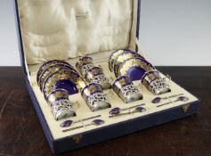 A cased Coalport porcelain and silver mounted coffee set, c.1934, retailed by Goldsmiths &
