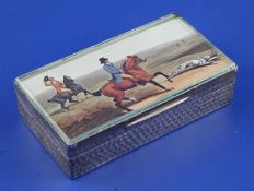 An Edwardian silver rectangular trinket box, with hammered panels and hinged glazed lid inset with