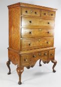 An 18th century Dutch oak and parquetry inlaid chest on stand, with two short and three long