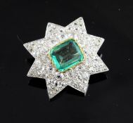 An Edwardian gold, emerald and diamond set star brooch, the central emerald weighing 2.91ct, with