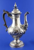 A George III silver pedestal coffee pot, of baluster form, with engraved armorials and later?