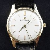 A gentleman`s 9ct gold Jaeger-LeCoultre automatic wrist watch, with baton numerals, on leather strap