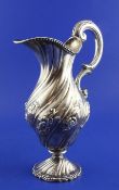 An early 19th century Portuguese? silver ewer, of pear form, with wrythened and foliate