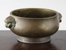 A Chinese bronze gui censer, Xuande mark, 17th / 18th century, of squat baluster form, with lion-