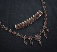 A 19th century French red paste set drop necklace and similar bracelet, with star shaped and navette