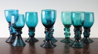 A harlequin set of eight late Georgian blue-green glass roemers, each with an ovoid bowl set on a