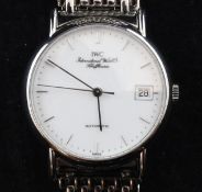 A gentleman`s stainless steel IWC automatic dress wrist watch, with baton numerals and date