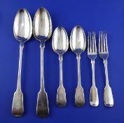 A set of nineteen Victorian silver fiddle pattern table forks, eleven table spoons & pair of basting