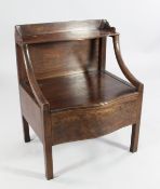 A 19th century serpentine mahogany bedside cabinet, with hinged lid and shelf back, on square