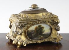 A 19th century ormolu table casket, decorated all over with shells and scrolls, each side mounted