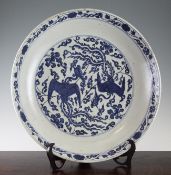 A large Chinese Ming blue and white `double phoenix` dish, Wanli period, painted to the centre