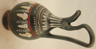 A Gnathian ware epichysis, 3rd century BC, typically painted with bands including fruiting vines