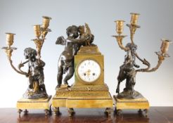 A late 19th century French bronze and ormolu three piece clock garniture, the clock surmounted