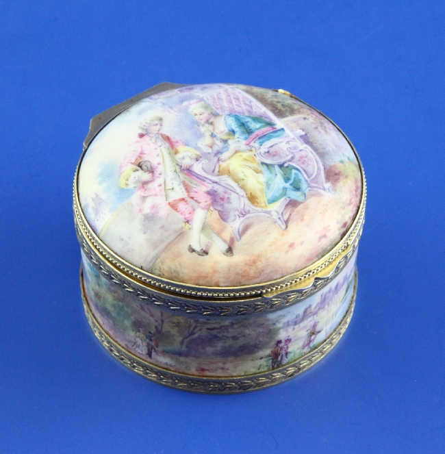A late 19th century French 950 standard silver mounted circular porcelain box, with domed hinged lid