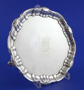 A Victorian silver waiter, of shaped circular form, with engraved armorial, on hoof feet, Edward Ker
