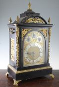 A Victorian ormolu mounted ebonised chiming bracket clock, in architectural case, the arched gilt