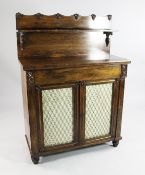 A William IV rosewood chiffonier, with single shelf back, frieze drawer and a pair of cupboard doors
