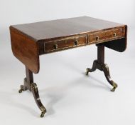 A Regency rosewood and brass mounted sofa table, with two frieze drawers opposing two dummy drawers,