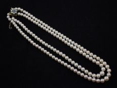 A double strand graduated cultured pearl necklace with 9ct gold, blue zircon and cultured pearl