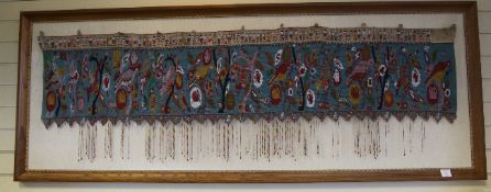 An Indonesian coloured beadwork wall hanging, Kalimantan, Borneo, late 19th / early 20th century,