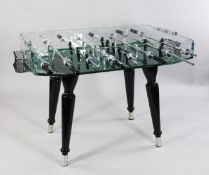 A Teckell B. Lab Italia glass table football game, with green glass base and tapering supports,