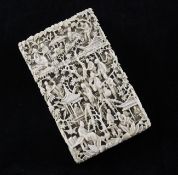 A Chinese export ivory card case, first half 19th century, carved in high relief with figures amid