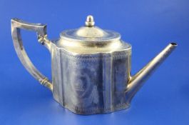 A George III silver teapot by Robert Hennell, of lobed oval form, with acorn finial and bright cut